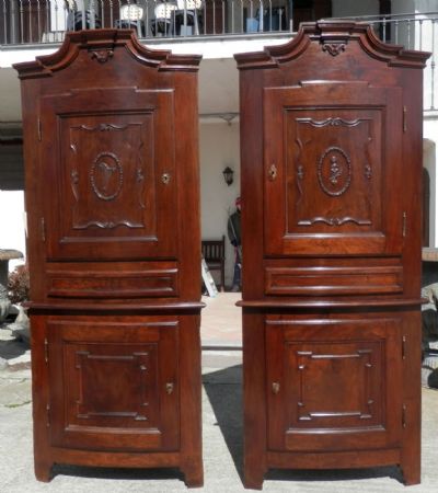 pair of corner cupboards