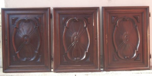 three carved doors