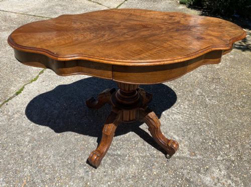 Walnut biscuit-shaped living room table
