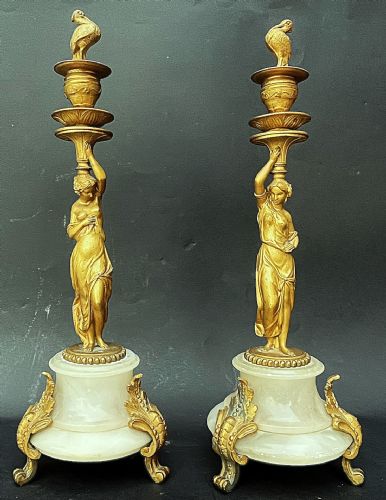 Pair of candlesticks supported by vestals