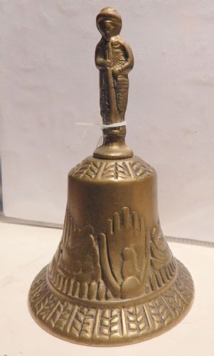 bell with a warrior figure
    
