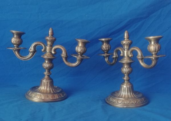 pair of candlesticks with two arms
    