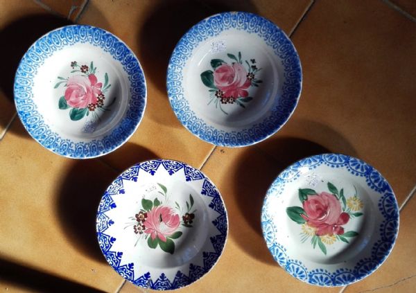 group of four painted plates
    