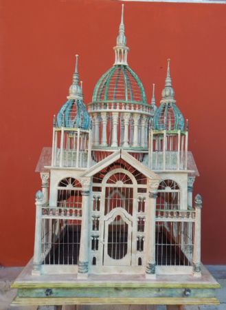 wooden cage in the form of a synagogue
    