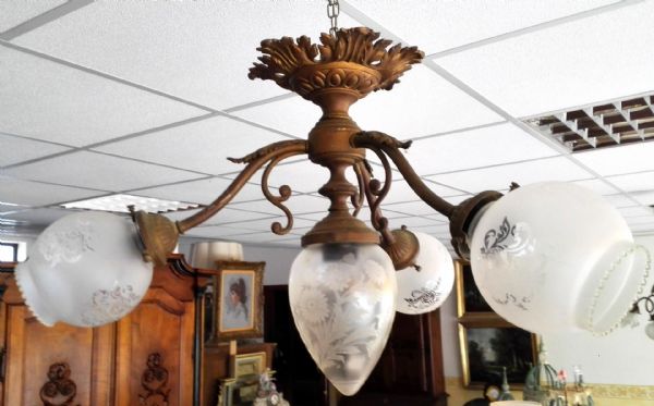 chandelier with jagged bowls and central pinecone
    