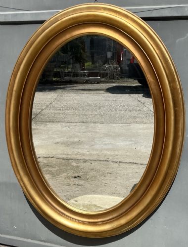 specchiera ovale in legno dorato