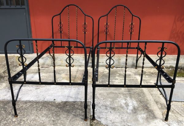 pair of wrought iron beds
    